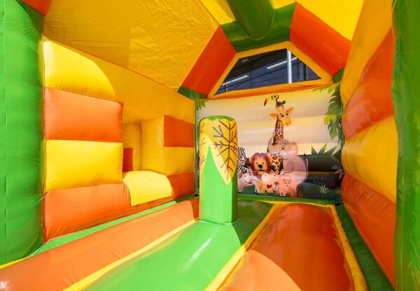 Chateau gonflable pour enfant, couleur orange - vert - jaune, avec toboggan